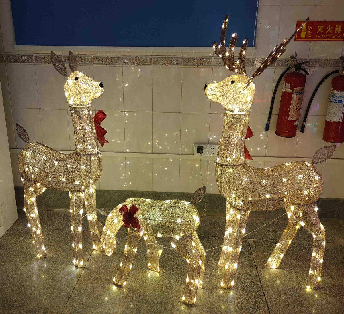 54 in, 46 in, and 23 in Gold Wire-Frame Lighted Deer Family Set with Warm White LEDs, Animated Motion, Iron Build, Red Bow Accents - media 1